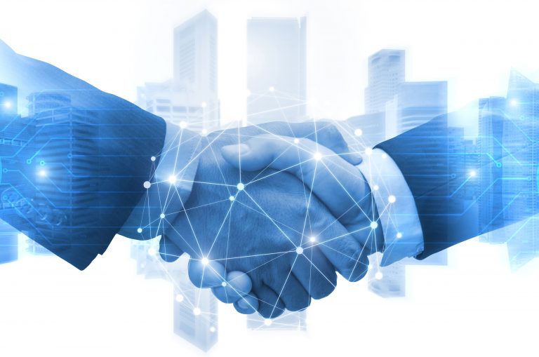 Partnership - business man shaking hands with effect digital network link connection graphic diagram, digital global technology with cityscape background, internet communication and teamwork concept